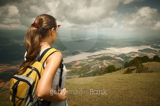Woman hiker with backpack standing on top of the mountain (474849164 ...