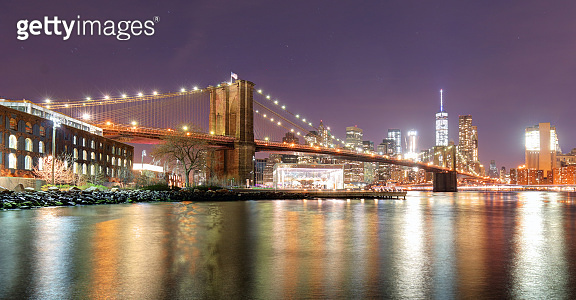 Brooklyn Bridge over East River at night in New York City Manhattan ...