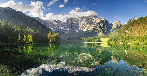 panorama of the Laghi di Fusine alpine lake in the Julian Alps in Italy ...