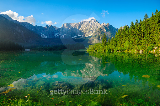 panorama of the Laghi di Fusine alpine lake in the Julian Alps in Italy ...