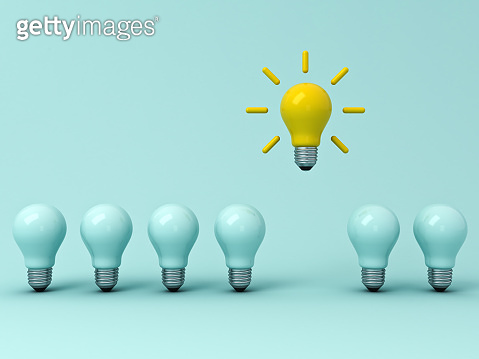 Think different concept , One yellow idea bulb standing out from the ...