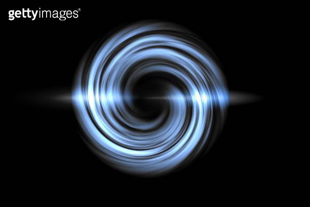 Glowing spiral tunnel with blue light circle on black backdrop ...