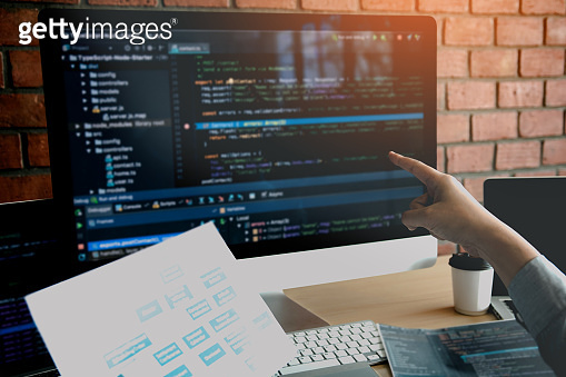 Man hands pointing coding html and programming develop on screen ...