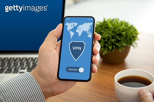 male hands holding phone with app vpn on the screen (1150298937) - 게티이미지뱅크