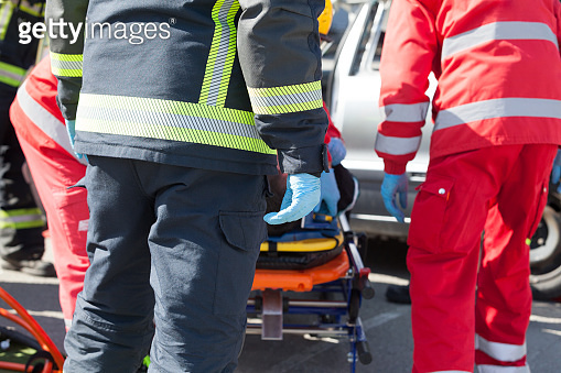 Paramedics and firefighters in urgent rescue operation after a car ...