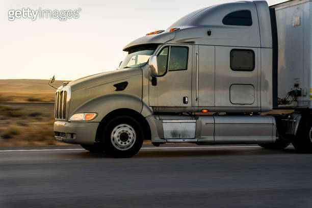 Closeup Side View Of A Semi Truck Cab Driving On A Two Lane Highway In ...
