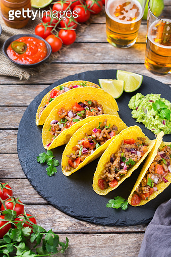 Taco shell nachos with beef, guacamole, chili, cheese salsa, tequila ...