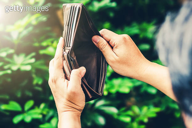 Poor man hand hold empty wallet no money due to economic finance ...