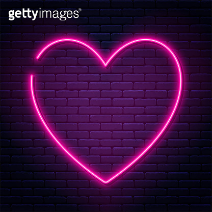 Neon sign in heart shape. Glowing neon heart on brick wall background ...