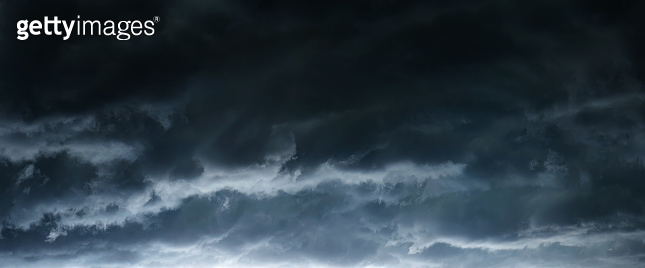 The typhoon, tornado in a stormy dark sky with black clouds and a ...