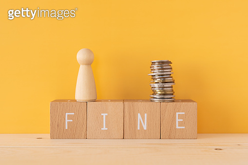 FINE; Four wooden blocks with "RISK" text of concept, a human toy, and ...
