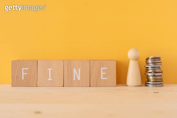 FINE; Four wooden blocks with "RISK" text of concept, a human toy, and ...
