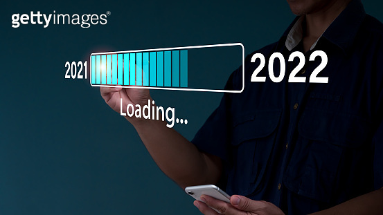 A businessman touches a virtual download bar with a loading progress ...