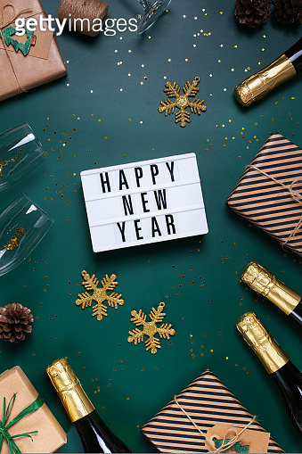 Happy New Year greeting card with champagne and gift boxes (1417221387 ...