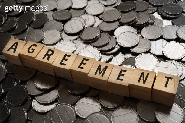 Wooden blocks with "AGREEMENT" text of concept and coins. (1449717228 ...