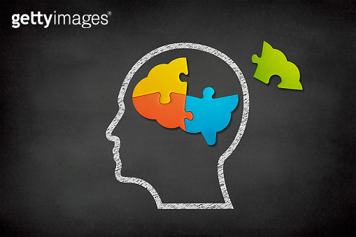 Brain shaped jigsaw puzzle on black background, a missing piece of the ...