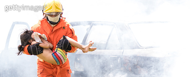Firefighter to save girl in fire and smoke. Rescue Team or Firefighters ...