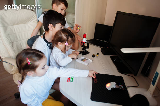 Kids using microscope learning science class at home. (1370653951) - 게티 ...
