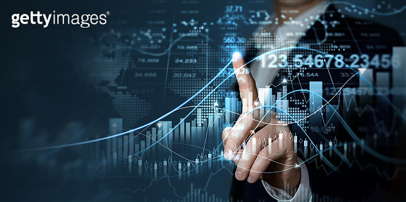 Businessman touches digital screen with growth graph analysing stock ...