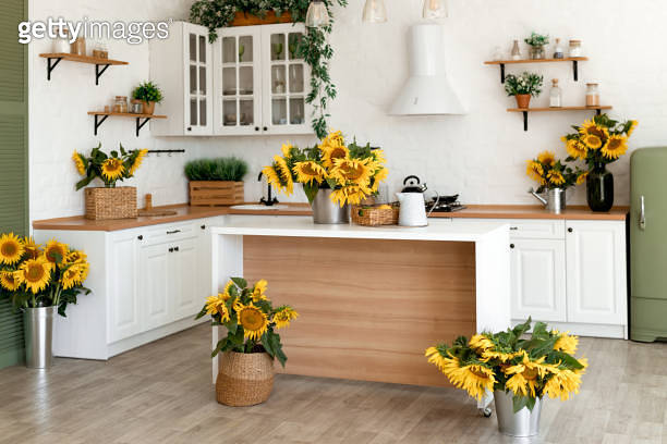 Modern Kitchen Interior with Island, Sink, Cabinets, and Sunflowers in ...