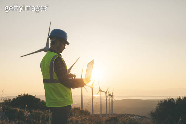 Renewable Energy Systems Innovator: Engineer Planning at Wind Turbines ...