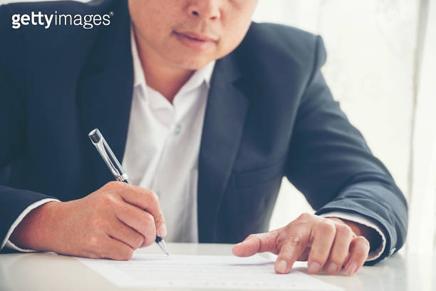 Businessman hand using pen signing on new contract starting projects in ...