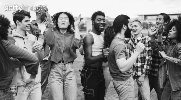 Young diverse people having fun outdoor dancing together - Focus on ...