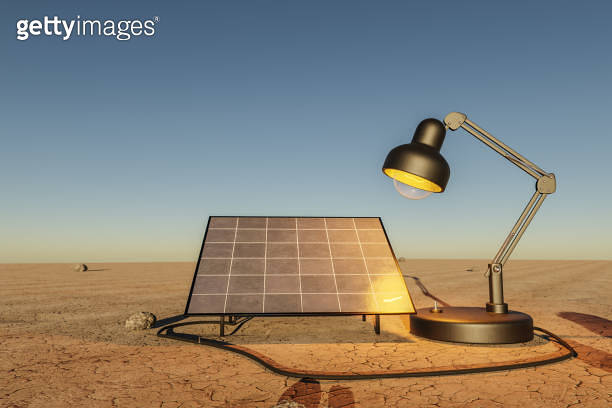 giant desk lamp shining light on solar panel in desert environment ...