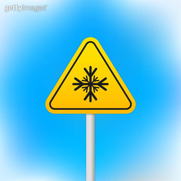 Carefully cold. Warning sign safety. A pillar with a sign. Isolated ...