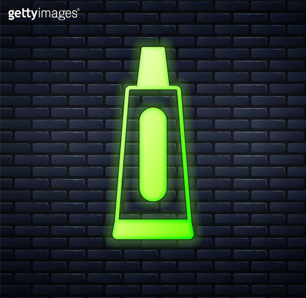 Glowing neon Tube of toothpaste icon isolated on brick wall background ...