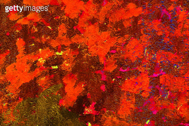Chaotic paint strokes. Stained burgundy red color painted wall surface ...