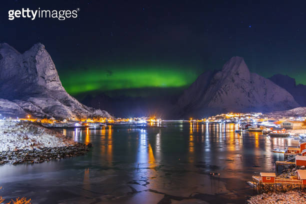 Aurora borealis northern lights over Lofoten Islands, Reine, Hamnoy ...