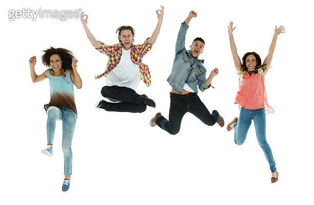 Excited four people jumping (520659499) - 게티이미지뱅크