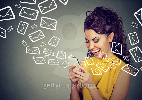 Happy woman busy sending messages on smart phone email icons flying out ...