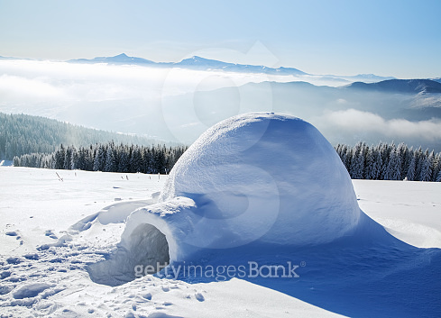 Marvelous huge white snowy hut, igloo the house of isolated tourist is ...