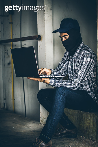 computer hacker of terrorist stealing information with laptop. 이미지 ...