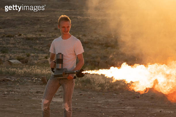 Young Man Operating a Flamethrower 이미지 (973508340) - 게티이미지뱅크