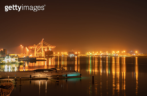 Tauranga Harbor Bridge and surrounds illuminates night sky and harbour ...