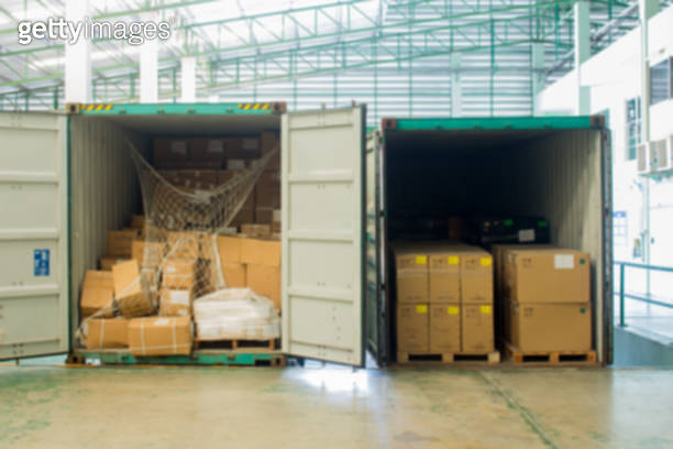 The cartons with loading out of container(Blur picture) (1014823258 ...
