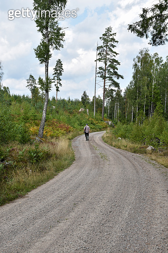 Walk Though Roud Recreation walk on a gravel road 이미지 (1058516842) - 게티이미지뱅크