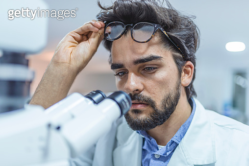 Positive Researcher Positive delighted scientist researching 이미지 (1040935154) - 게티이미지뱅크