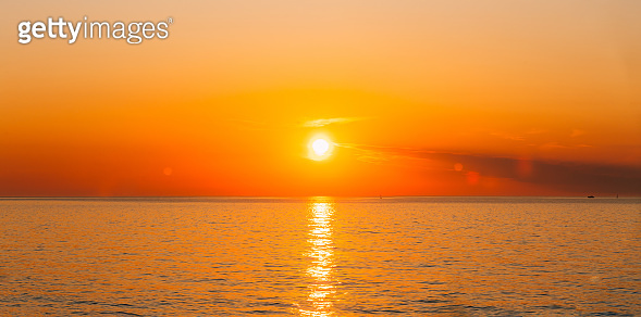 Hot Sun Rising Sun Is Setting On Horizon At Sunset Sunrise Over Sea Or Ocean. Tranquil ...