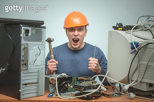 Computer repairman. IT Support. Computer technician engineer man ...