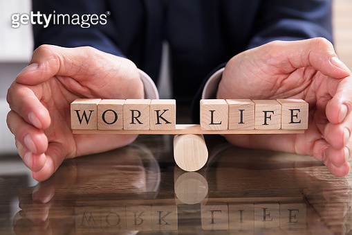 Protecting Balance Between Life And Work On Seesaw (928078176) - 게티이미지뱅크