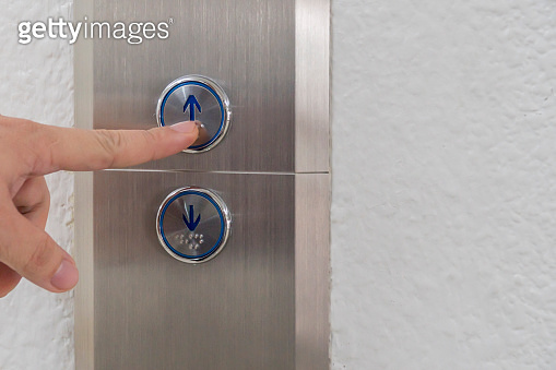 Using hands, press the elevator up and keypad elevator (948383404) - 게티 ...
