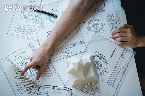 Engineering Design Hand Engineering man's hand working with 3D printer's components and ...