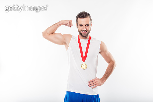Lucky, attractive, powerful, sporty, athletic man having gold medal ...