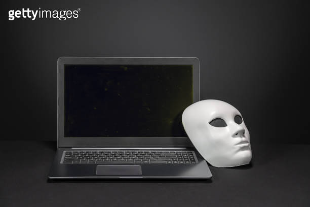 Laptop with empty black screen and white anonymous mask 이미지 (1165713509 ...