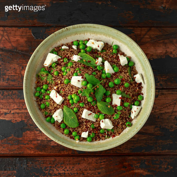Quinoa salad with green pea, mint, feta cheese and chilli flake