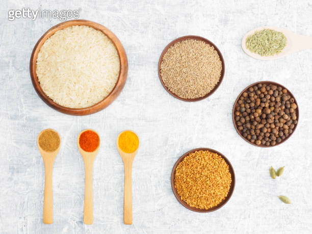 Spices set and rice on white concrete background. Modern apothecary ...